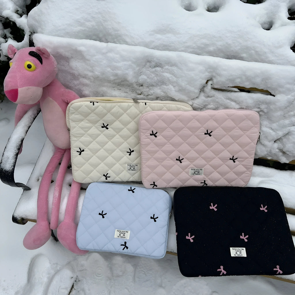 Laptop storage bag with rhombus embroidered bow decoration in nylon material showing colour options
