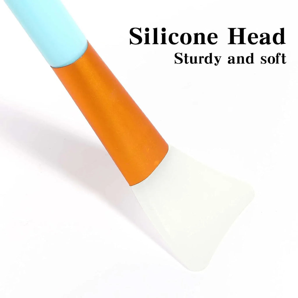 Reusable silicone face mask applicator spatula in one of six colours: black, blue, pink, rose red, white, or yellow.