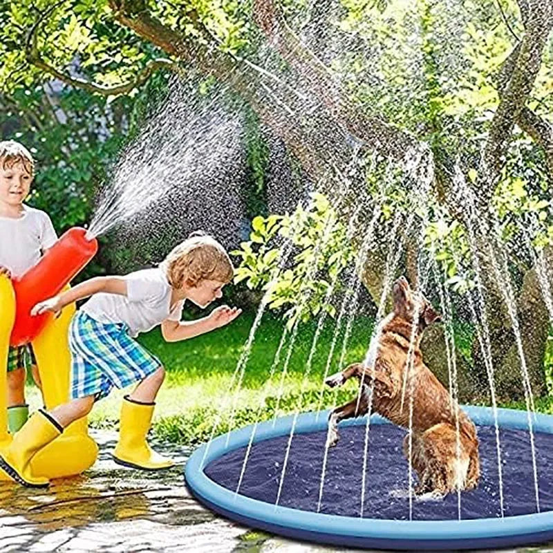 Inflatable blue dog sprinkler pool mat with anti-slip texture, connected to a garden hose in a garden.