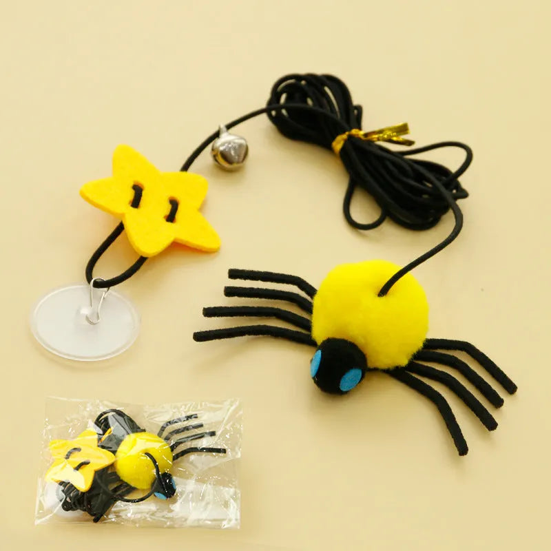 Red cat hanging door toy with elastic rope, feather, bell, and spider decoration