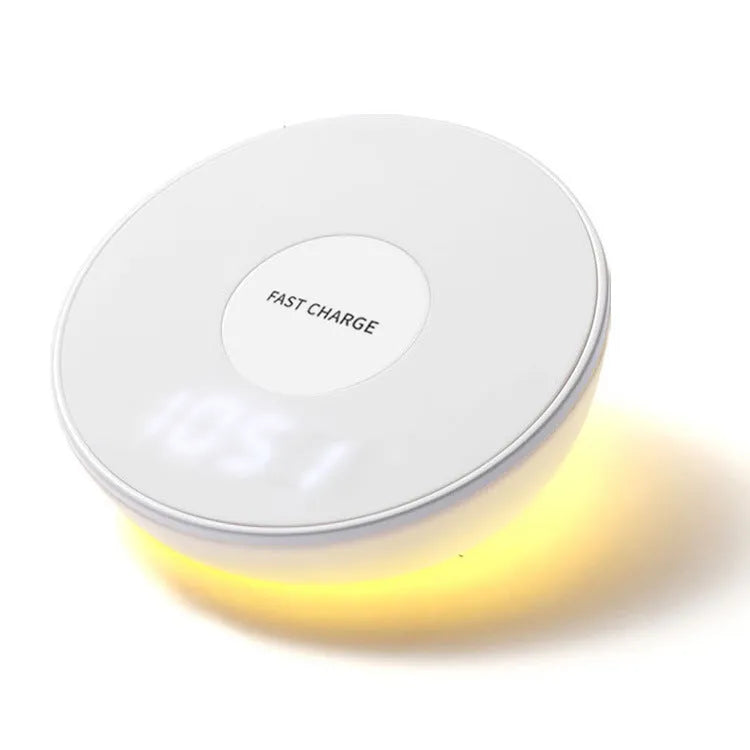 White rectangular wireless charging pad with a digital clock display on the front.