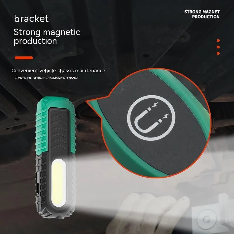 Black and green auto repair work light with USB charging cable and PET-coated ABS construction