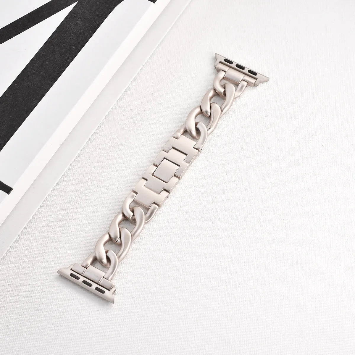 Denim chain pattern metal watch strap for Apple Watch in silver, shown with 22mm lugs.