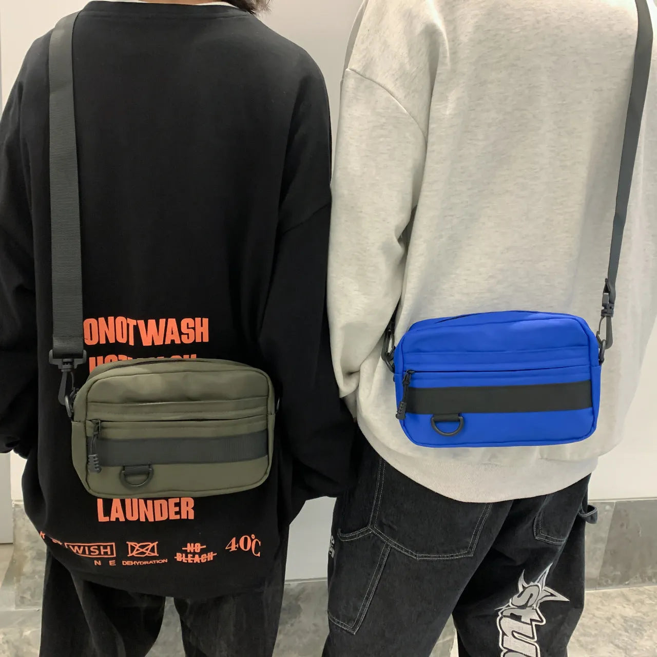 Men's street style messenger bag in solid colour with crossbody strap and sewing thread detailing