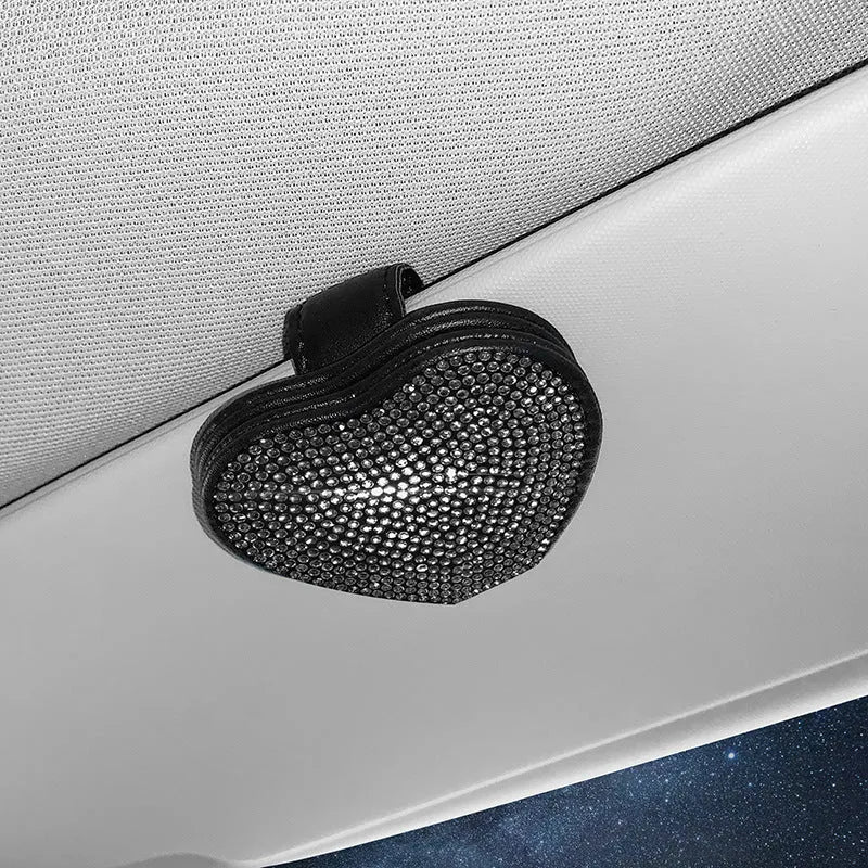 Diamond decorated PU leather magnetic clip for car sun visor holding sunglasses.