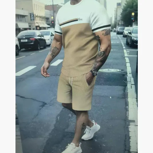 Men's loose fit short-sleeved polyester T-shirt and matching shorts set in a light colour.