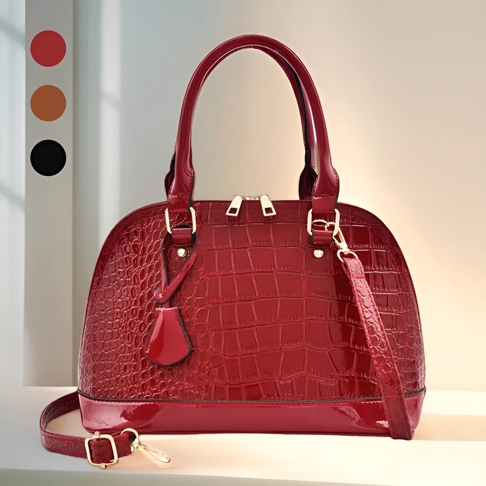 Large shiny black PU leather crossbody shoulder bag showing shell-shaped structure.