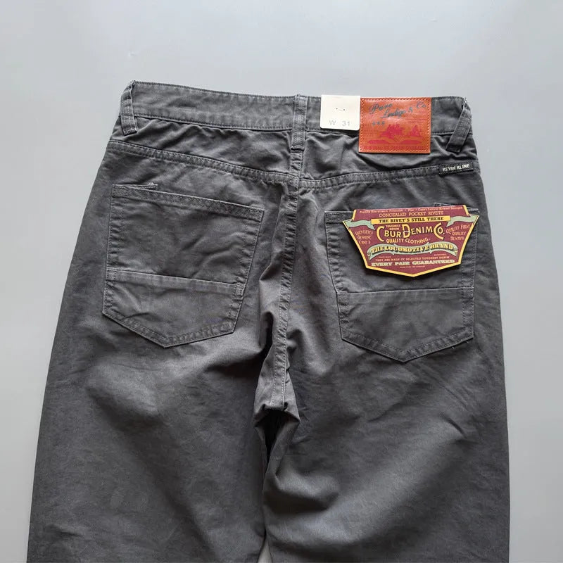 Men's straight-leg casual cotton trousers in army green colour on a mid-waist fit model.