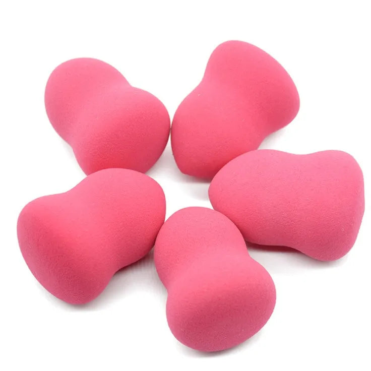 Pink hydrophilic non-latex makeup sponge puff measuring 4 by 4 by 5.6 centimetres.