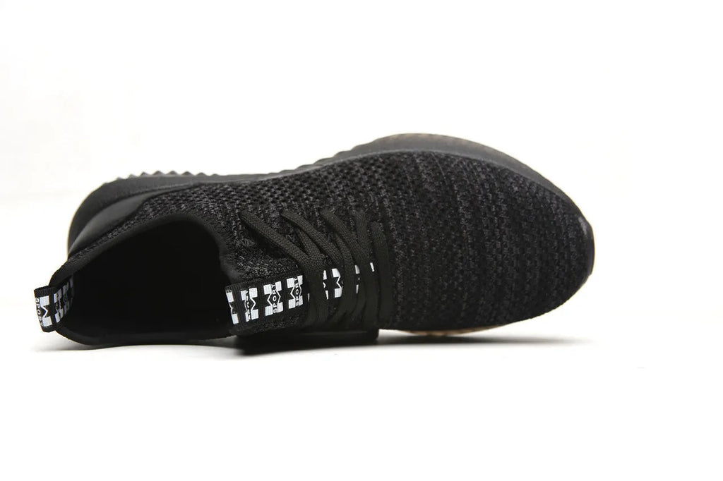 Work safety shoes with steel toe cap in black colour showing low-cut EVA construction