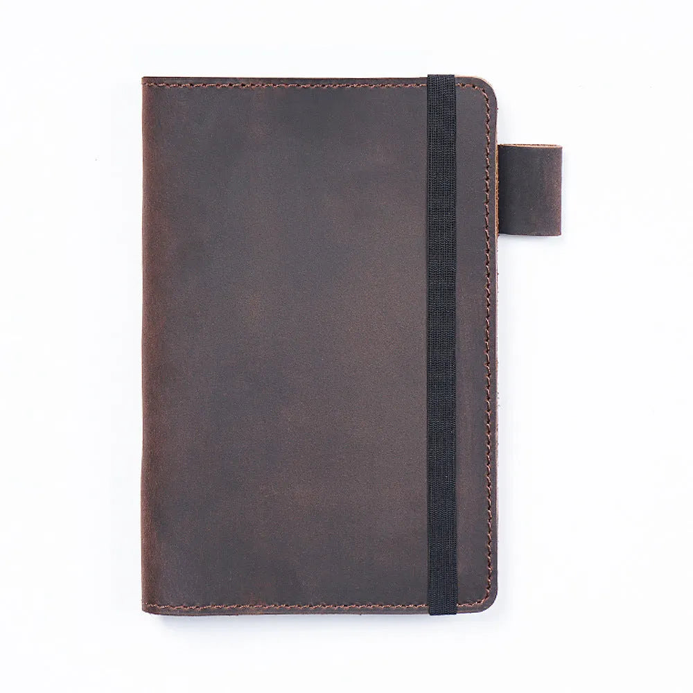 Handmade old-fashioned kraft notebook with cowhide cover, open to show 9x14cm wood-free paper