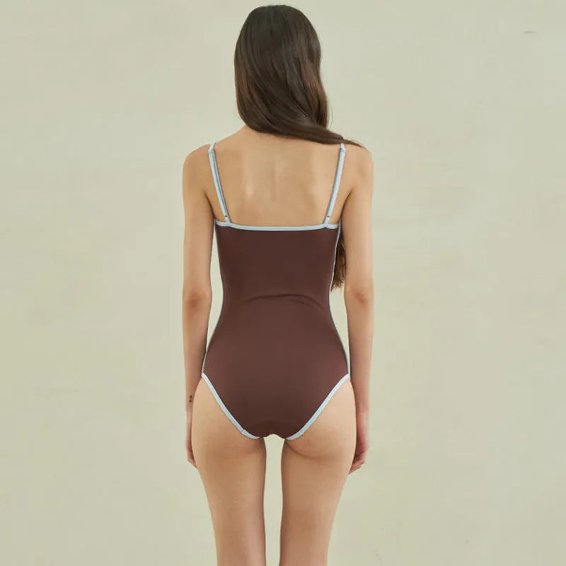Brown women's one-piece swimsuit with triangle top design and sexy pattern