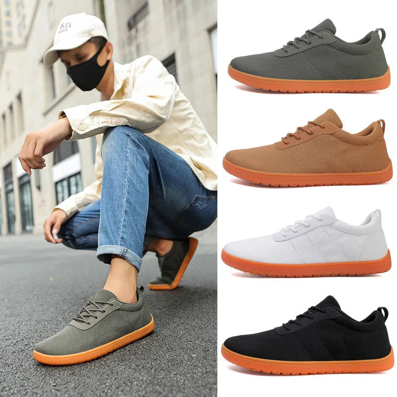 Men's low-top casual walking shoes in black with Flyknit upper, round toe, and rubber sole on a plain background.