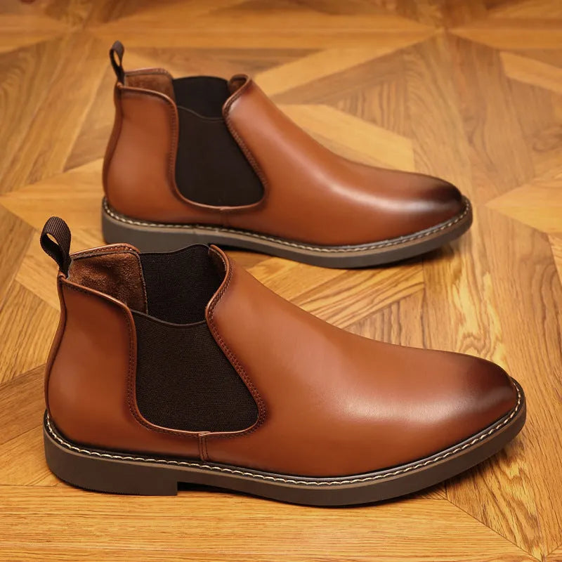 Men's black formal pointed-toe leather boots with a square rubber heel on a plain background