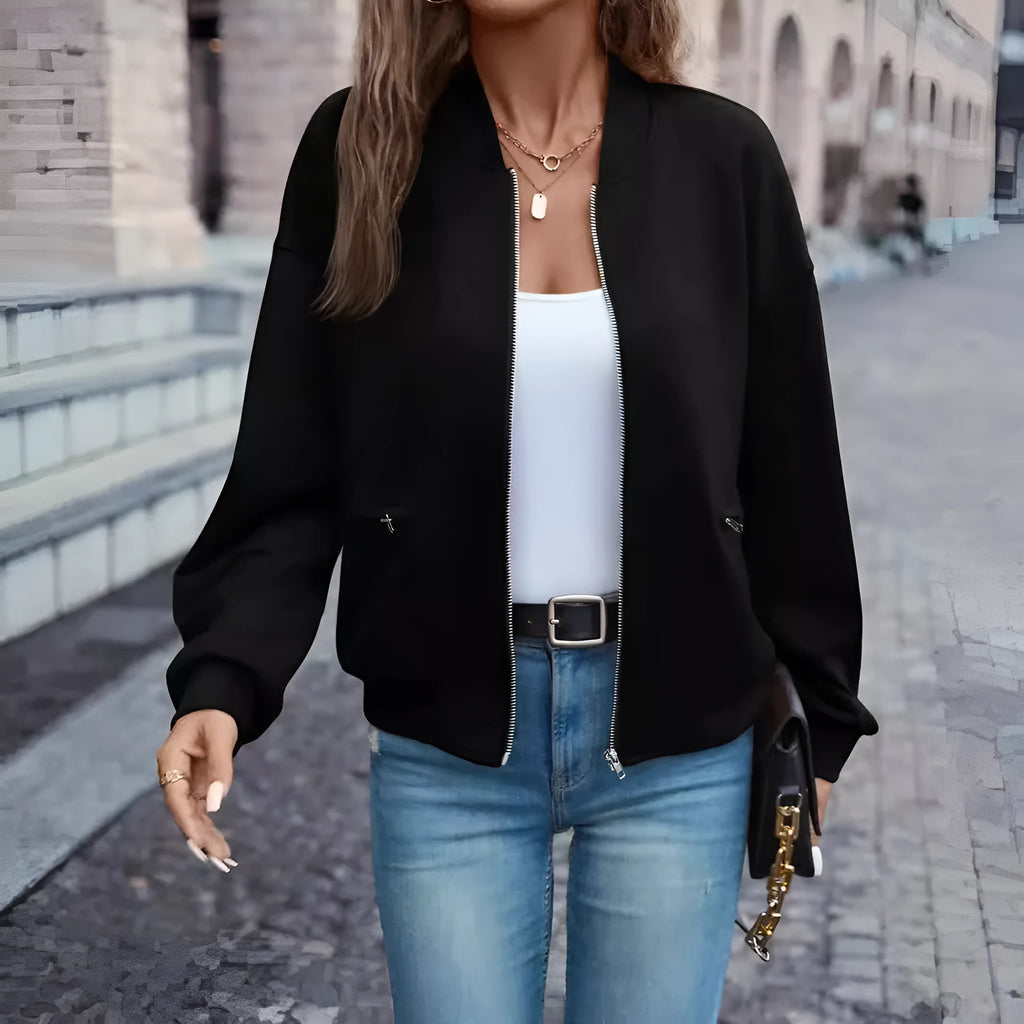 Black women's long sleeve zip jacket with faux pockets, casual style.
