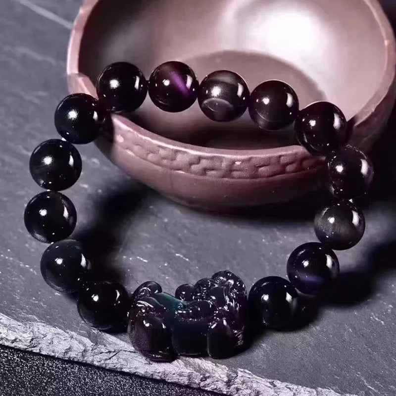 Natural ice colour obsidian crystal bracelet with spherical beads on wrist