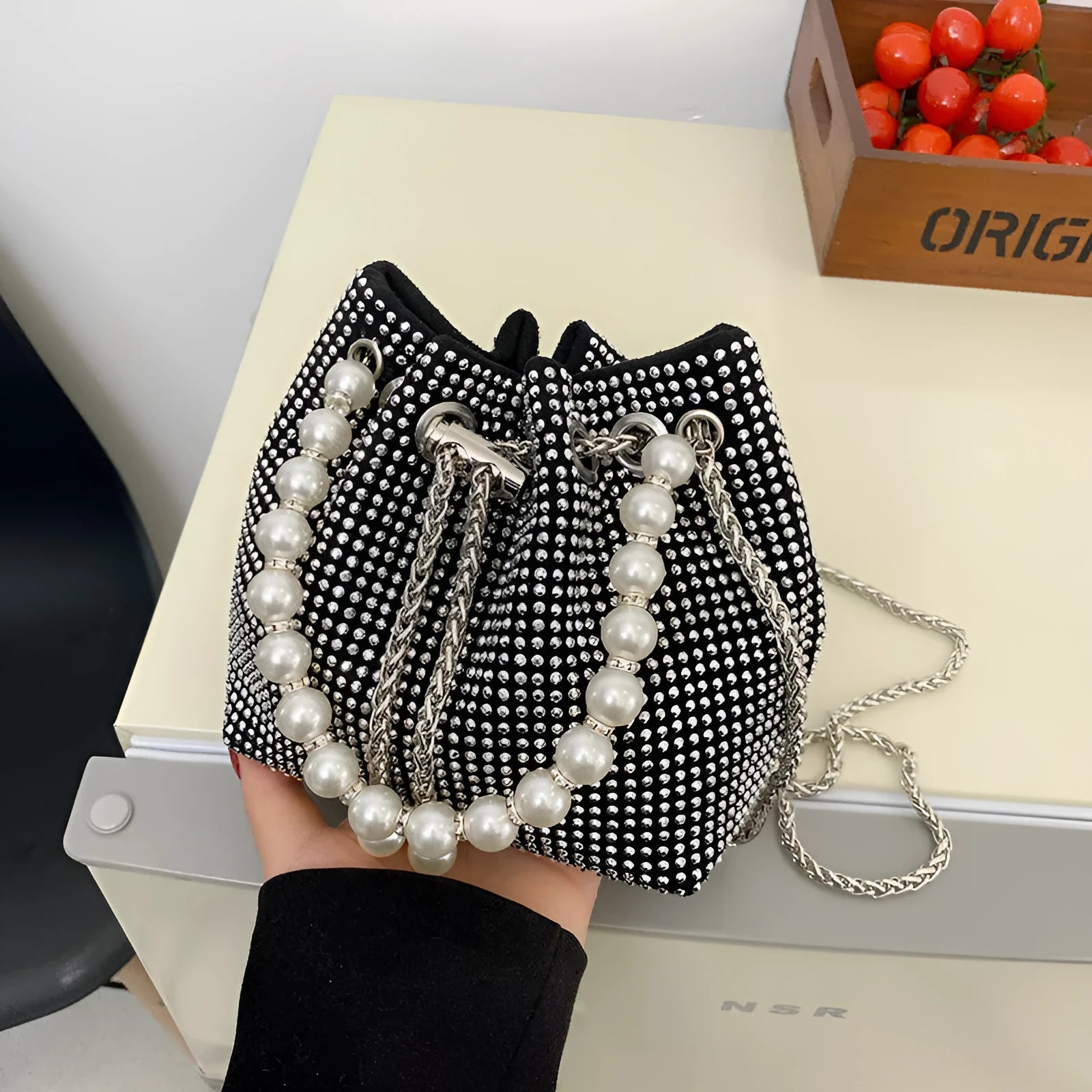 Women's diamond pattern PU leather crossbody shoulder bag with Western chain detailing and bucket shape