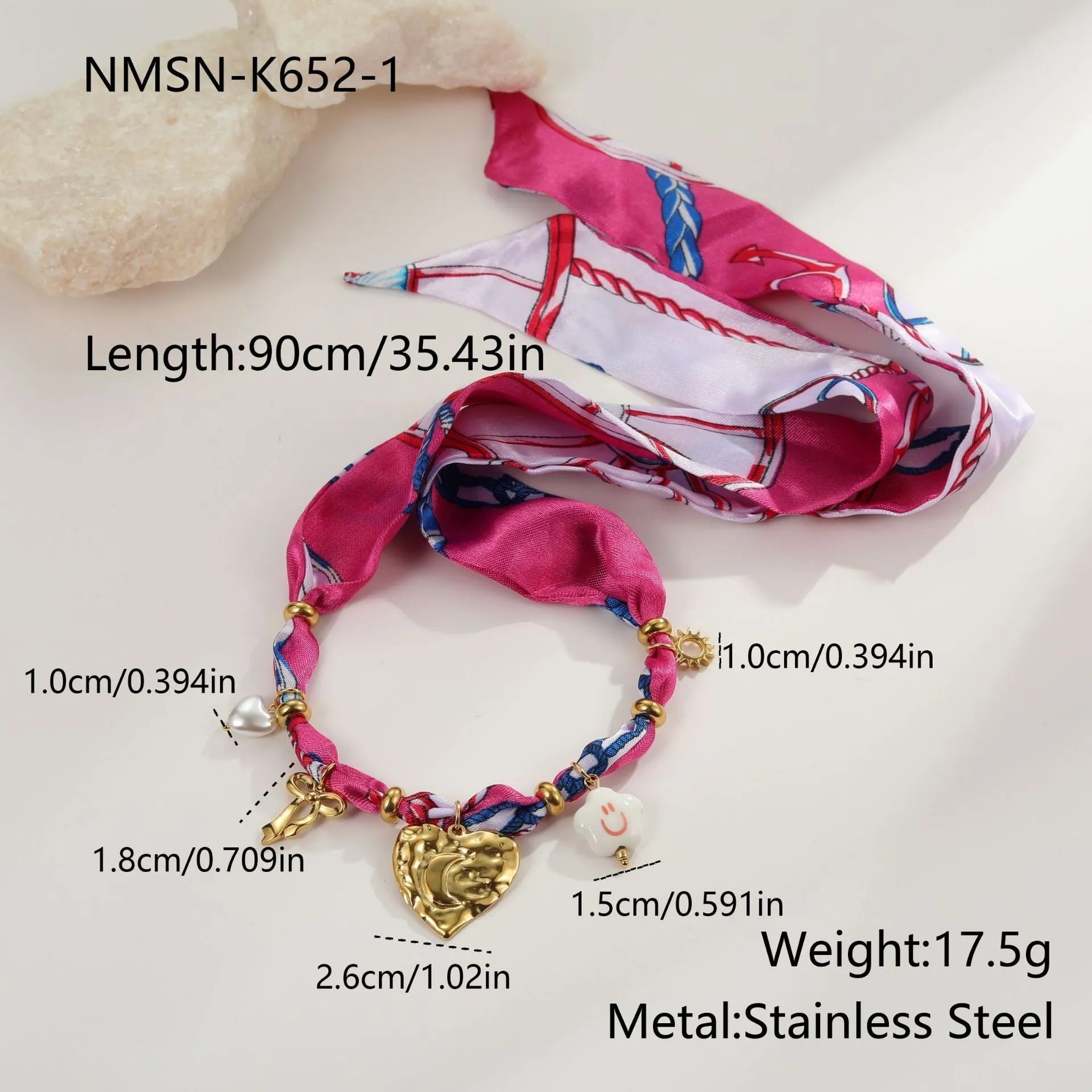 Women's geometric chain necklace and bracelet set with colourful pendant on a white background.