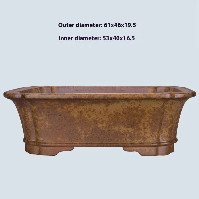Purple sand rectangular flowerpot showing textured segment mud construction and geometric angles.