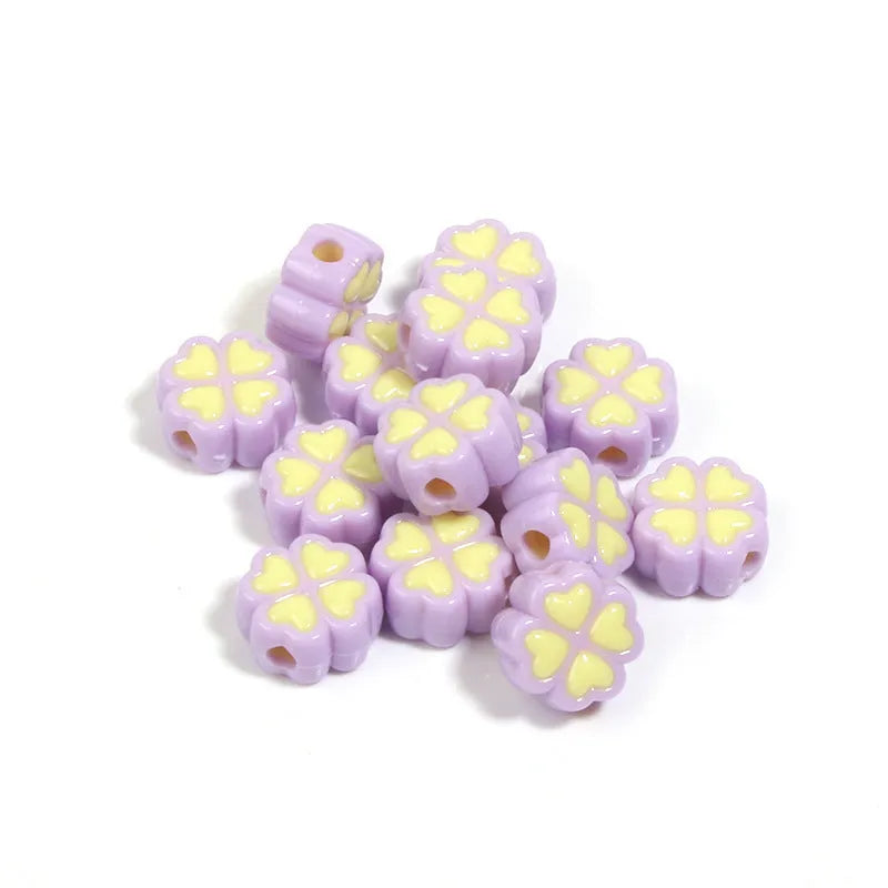 Assorted light-coloured acrylic clover-shaped beads with frosted finish, 15mm size.