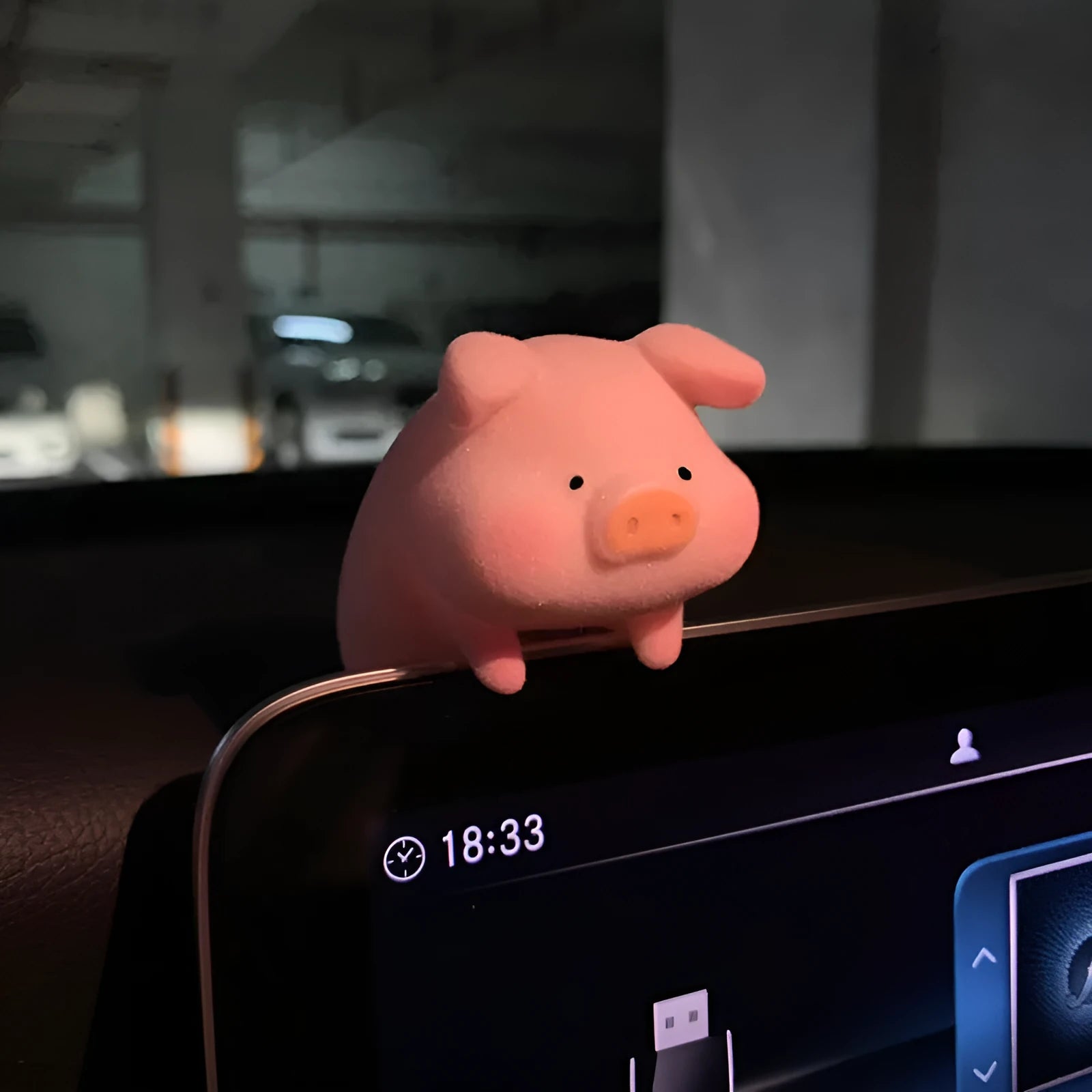 Colourful 3D resin cartoon pig figurine car decoration on a car dashboard