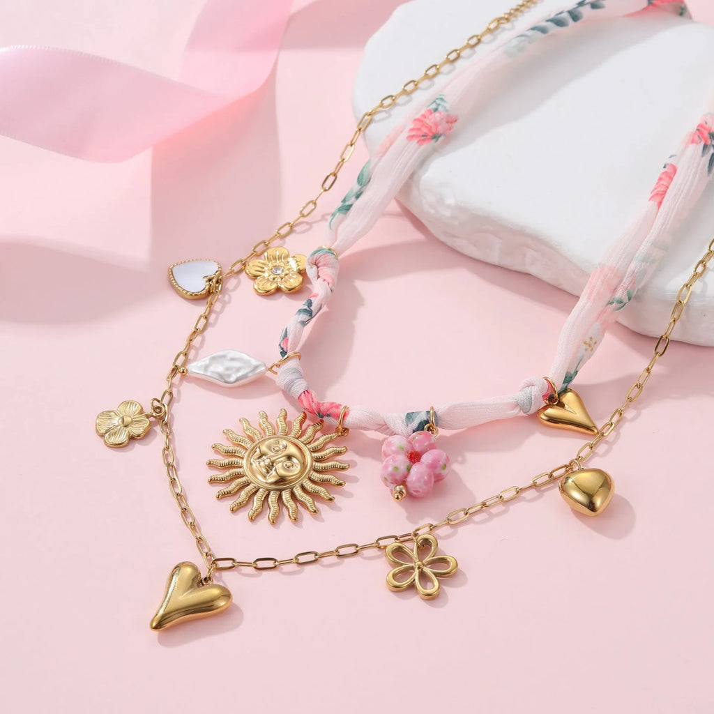 Gold plated stainless steel sun pendant necklace with geometric design on adjustable chain