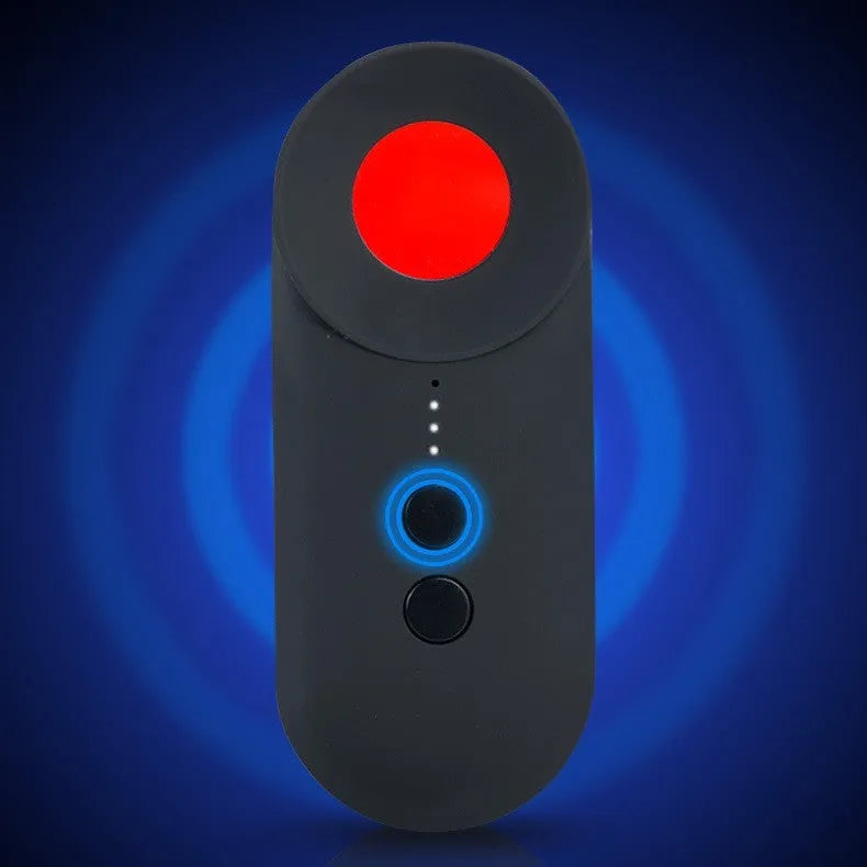 Black portable GPS and WiFi signal detector with laser scanner for hidden cameras on a table.