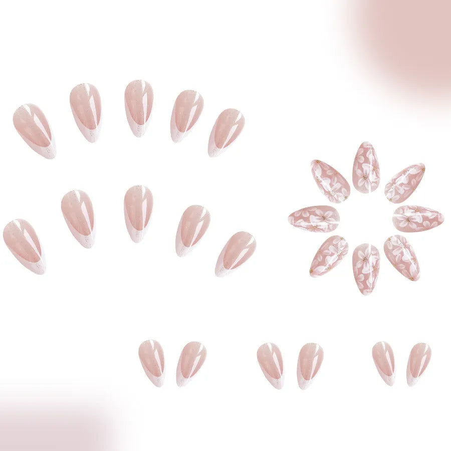 Short glossy almond French artificial nails with glittering powder flower decoration