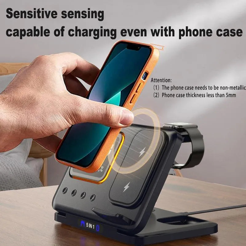 Black and white wireless charging station with phone, watch, and headphones on dock, showing LED time and temperature display.