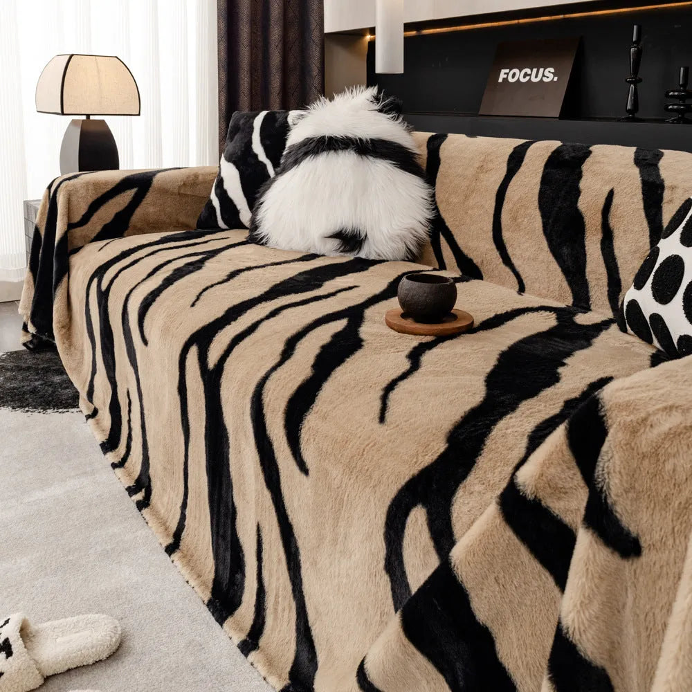 Zebra pattern flannel sofa slipcover in caramel colour, shown on a grey sofa