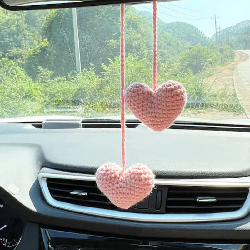 Knitted green and white car plant decoration with hanging rope