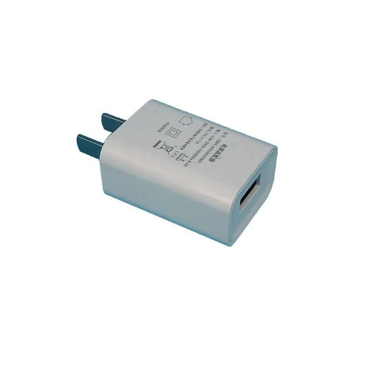 Thin white 5V 1A USB charger with international plug pins for mobile phones