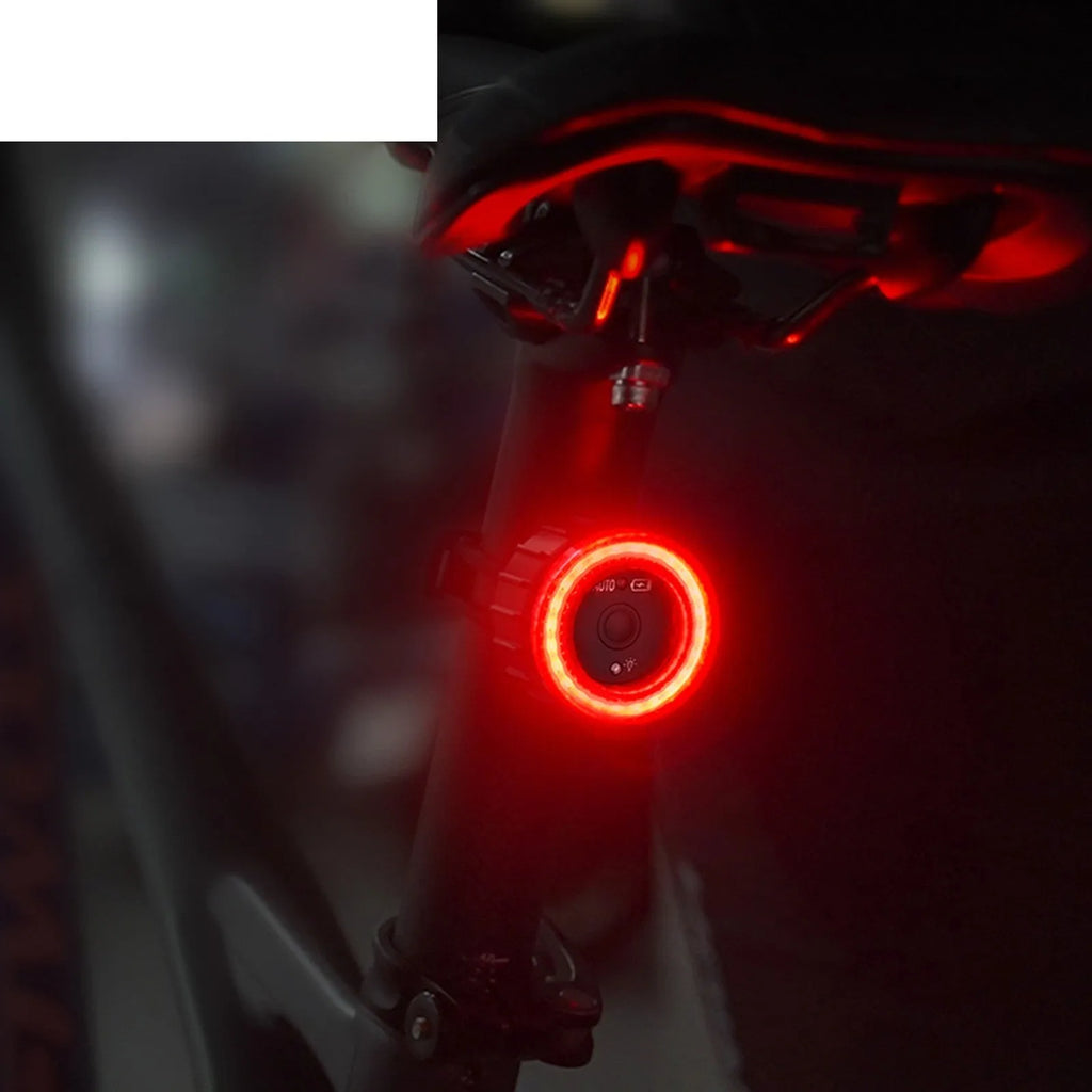 Black intelligent induction brake taillight for bicycles with aluminium alloy housing and dual mounting brackets