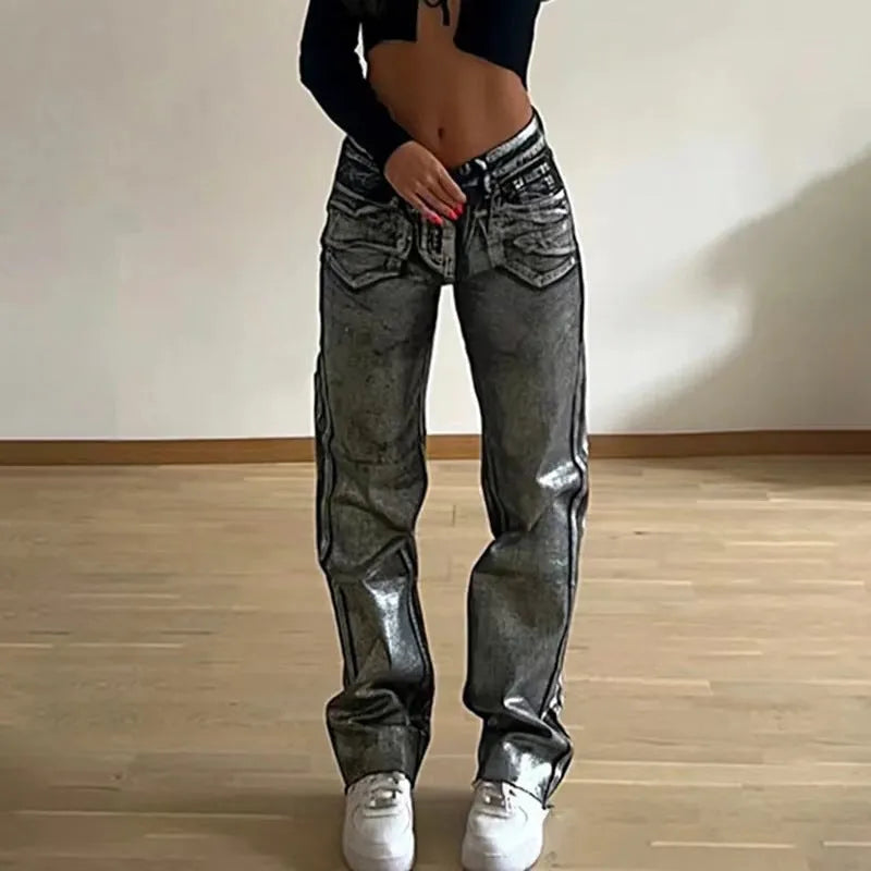 Women's blue high waist straight leg jeans with silver contrast detailing on denim fabric