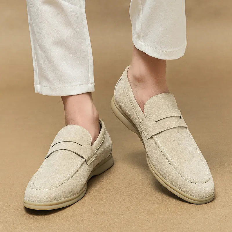 Men's black slip-on leather casual shoes with round toe and a mid-height rubber sole.
