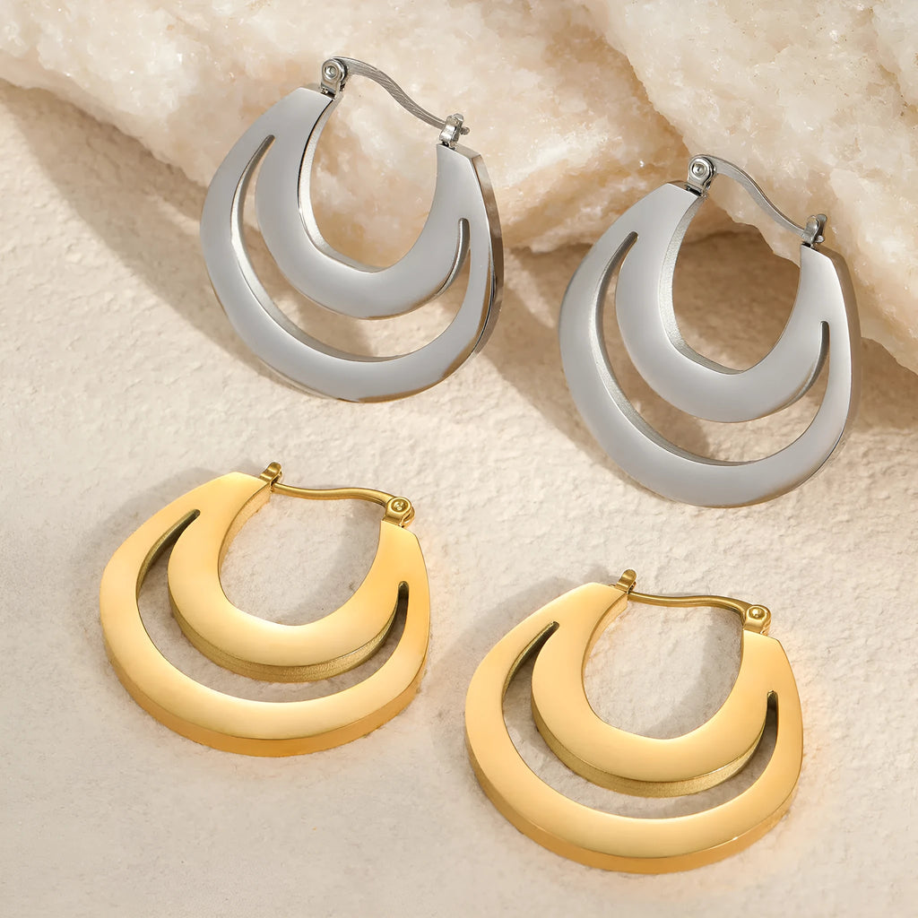 Geometric French earrings with circular ring design in gold and steel metallic finishes