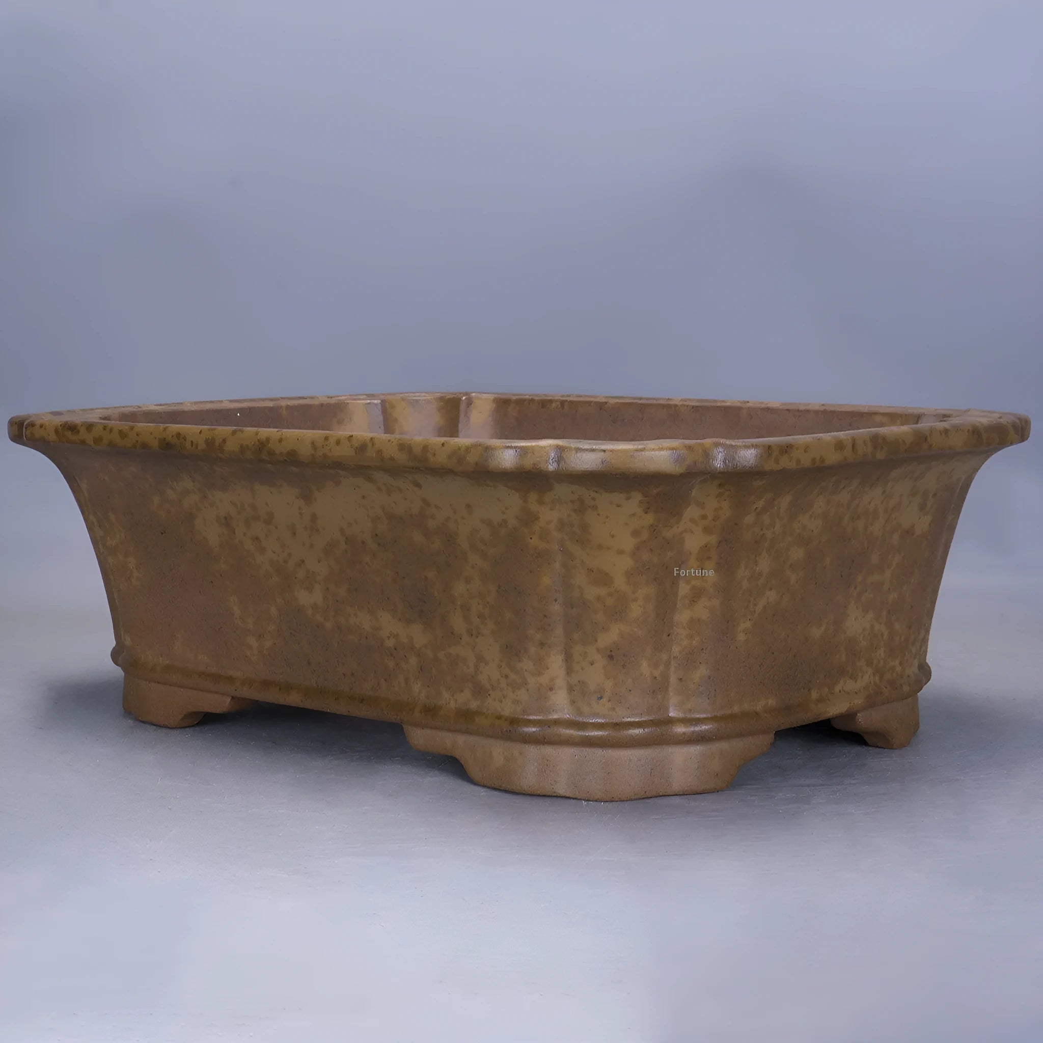 Purple sand rectangular flowerpot showing textured segment mud construction and geometric angles.