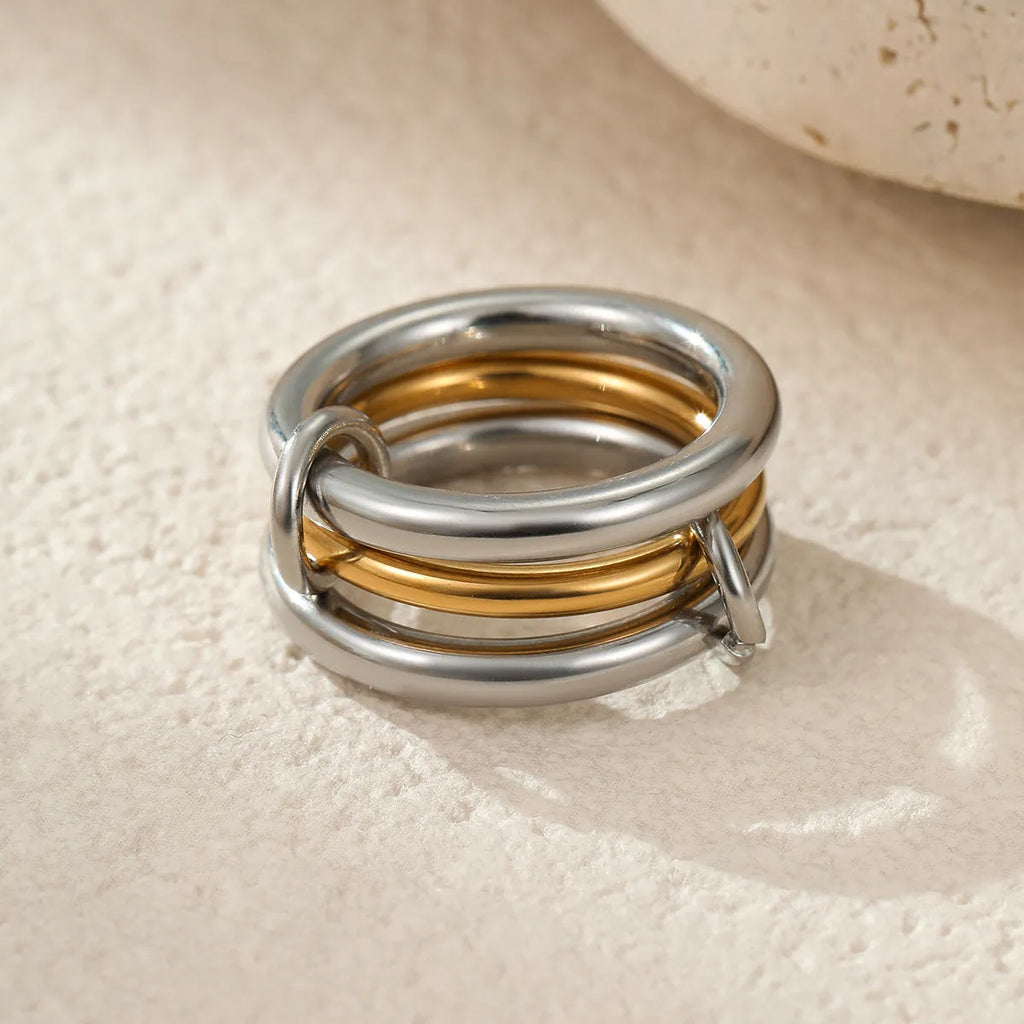 Stacked colour matching stainless steel rings with 18K gold plating in three colour variants for women