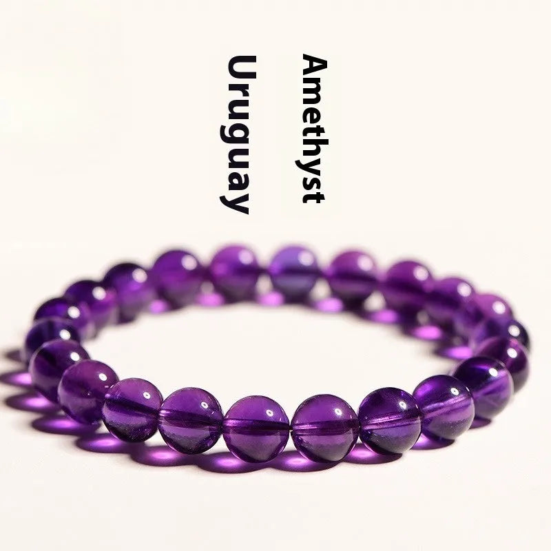 Natural amethyst scattered bead bracelet made from polished Uruguayan crystal in various sizes.