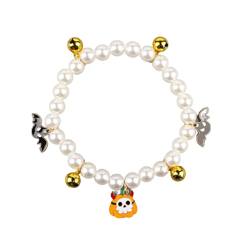 Halloween-themed cat collar with simulated pearl necklace decoration showing pumpkin designs