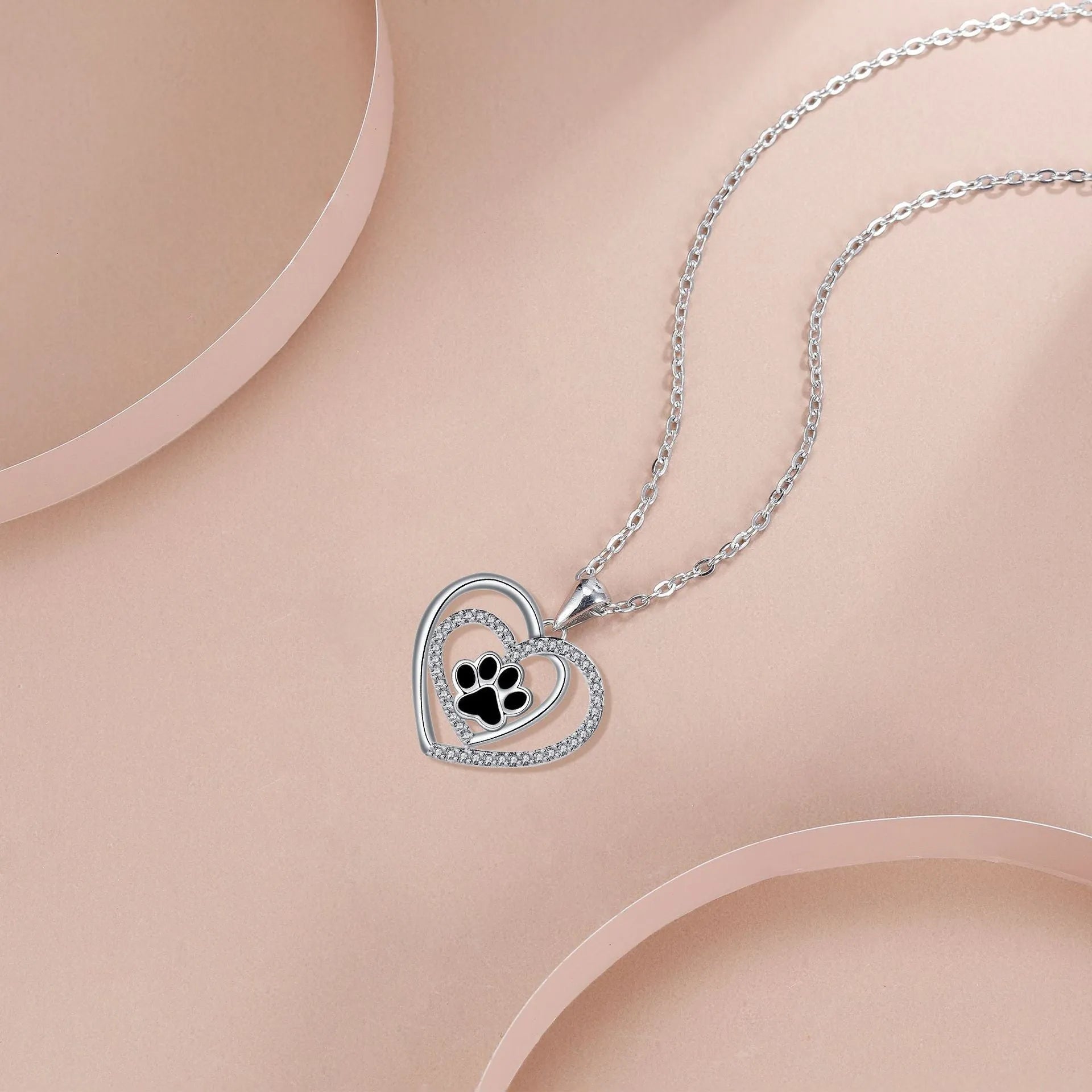 Women's dog paw necklace with heart pendant on cross chain, electroplated copper construction