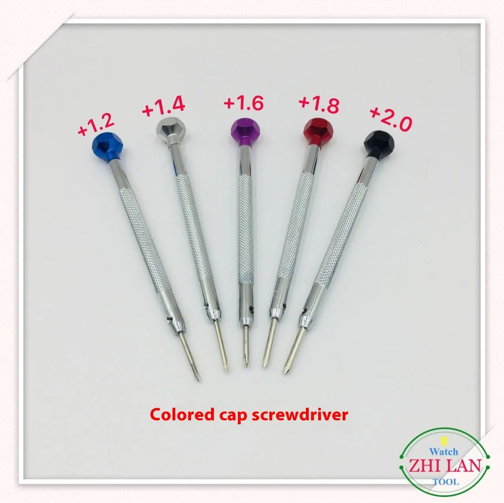 Six colour-coded watch repair screwdrivers with copper handles arranged in aluminium case