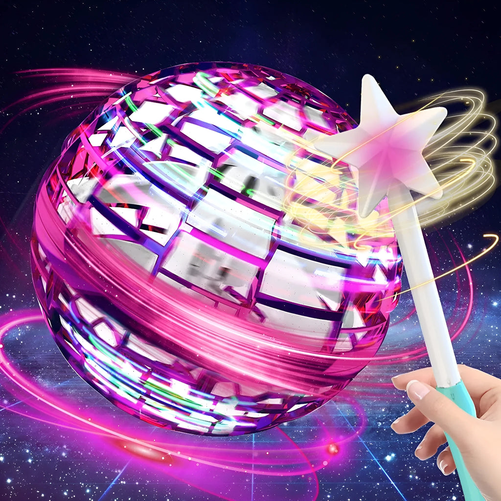 Soft blue spinning flying ball toy with LED lights hovering above a child's hand next to a magic wand.