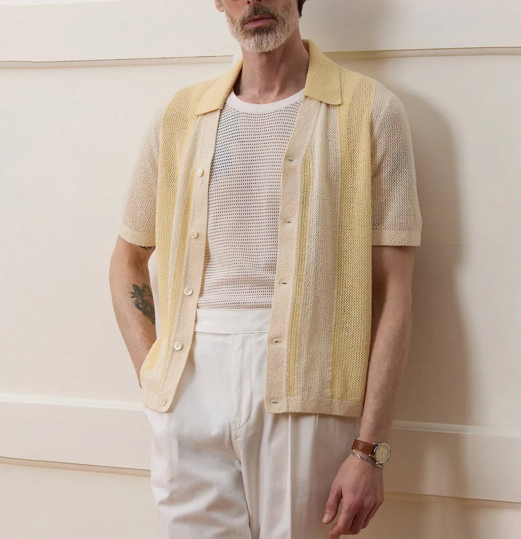 Yellow men's polo shirt with hollow-out knit design and asymmetric details in Tencel fabric