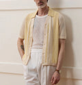 Yellow men's polo shirt with hollow-out knit design and asymmetric details in Tencel fabric