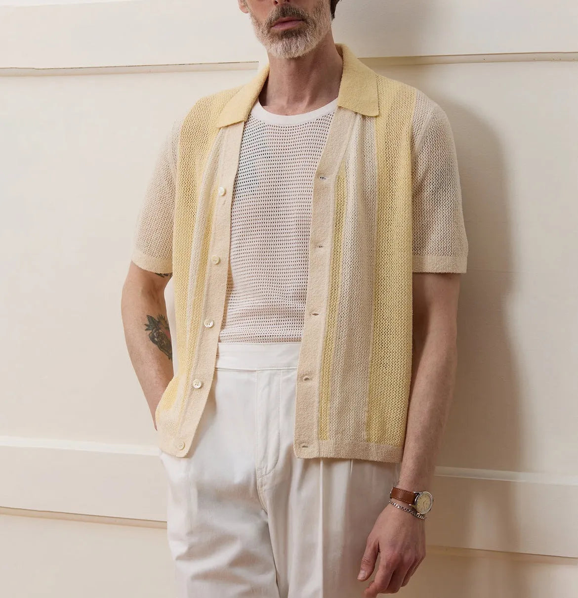 Yellow men's polo shirt with hollow-out knit design and asymmetric details in Tencel fabric
