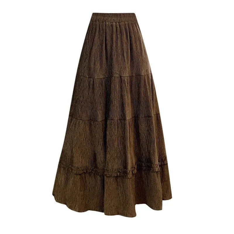 Korean-style solid colour corduroy A-line midi skirt with an elastic waistband.