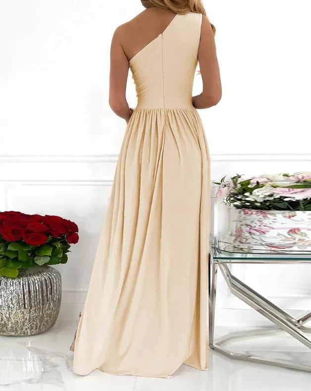 Apricot one shoulder maxi dress with high leg split and cutout detail on a mannequin.
