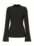 Men's black long sleeve pullover top with lantern sleeves and a sunken stripe pattern on the fabric.