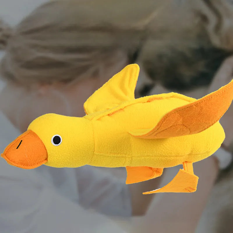 Yellow dog training toy with duck sound module and central treat dispenser slot